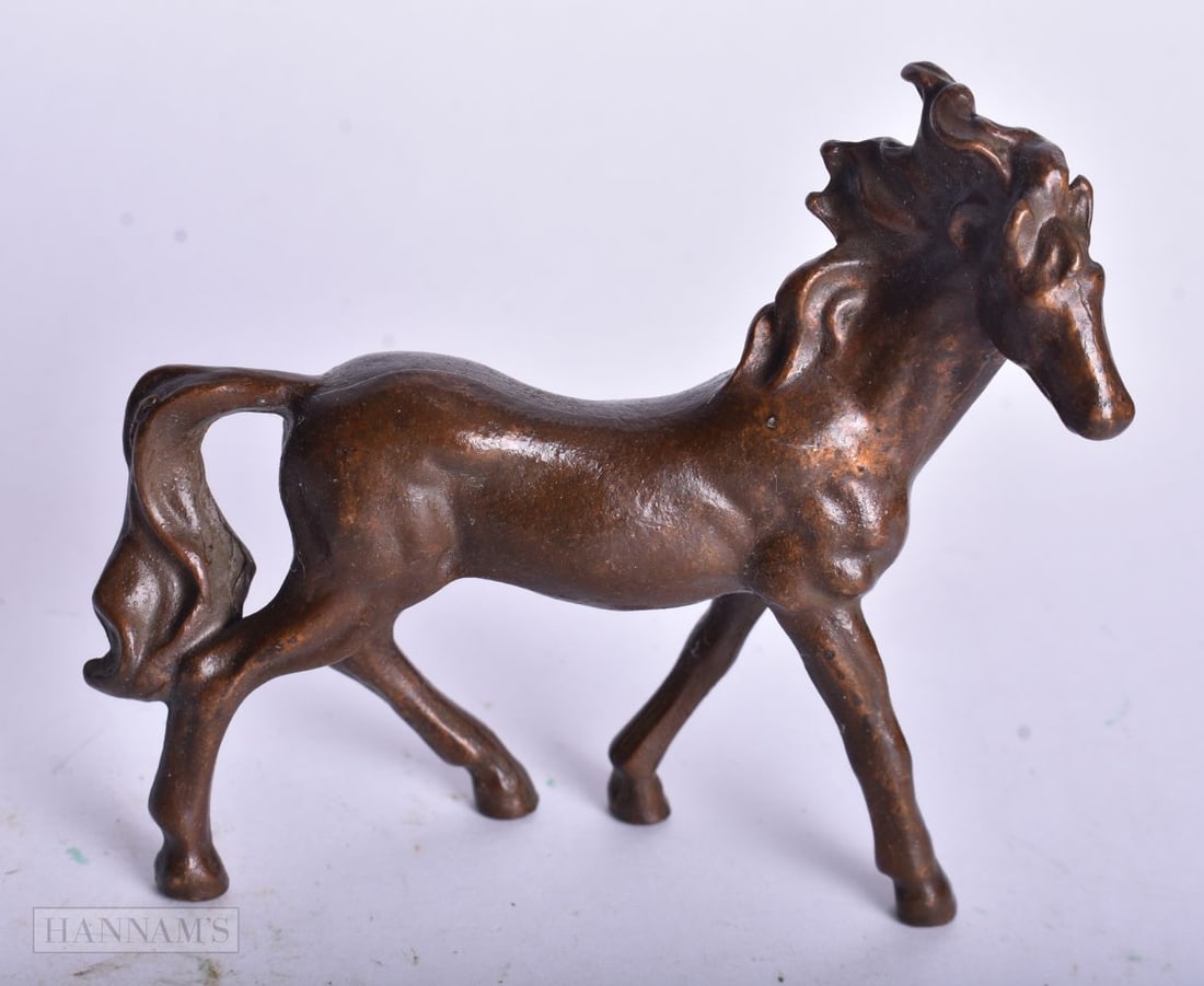 A JAPANESE BRONZE HORSE. 8.75 cm x 7.75 cm.: A JAPANESE BRONZE HORSE. 8.75 cm x 7.75 cm.