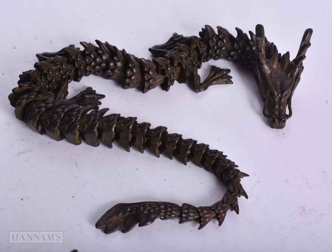 A JAPANESE BRONZE ARTICULATED DRAGON. 32.5 cm long. (1 of 2)
