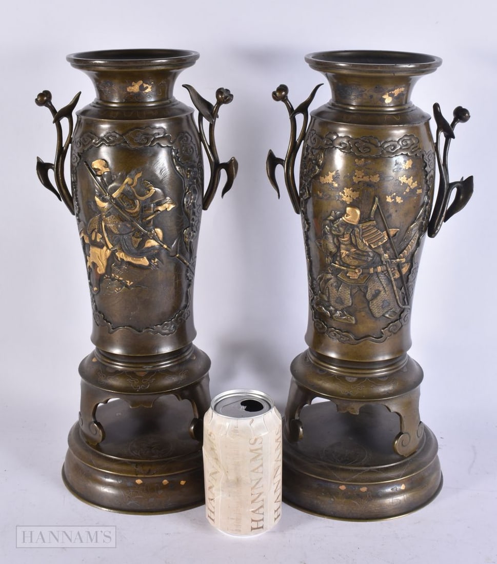 A LARGE PAIR OF 19TH CENTURY JAPANESE MEIJI PERIOD SILVER AND GOLD INLAID VASES decorated with samur: A LARGE PAIR OF 19TH CENTURY JAPANESE MEIJI PERIOD SILVER AND GOLD INLAID VASES decorated with samurai. 39 cm high.