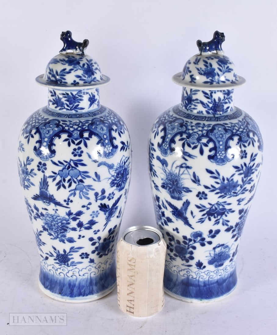A LARGE PAIR OF 19TH CENTURY CHINESE BLUE AND WHITE PORCELAIN VASES AND COVERS bearing Kangxi marks: A LARGE PAIR OF 19TH CENTURY CHINESE BLUE AND WHITE PORCELAIN VASES AND COVERS bearing Kangxi marks to base. 36 cm high.