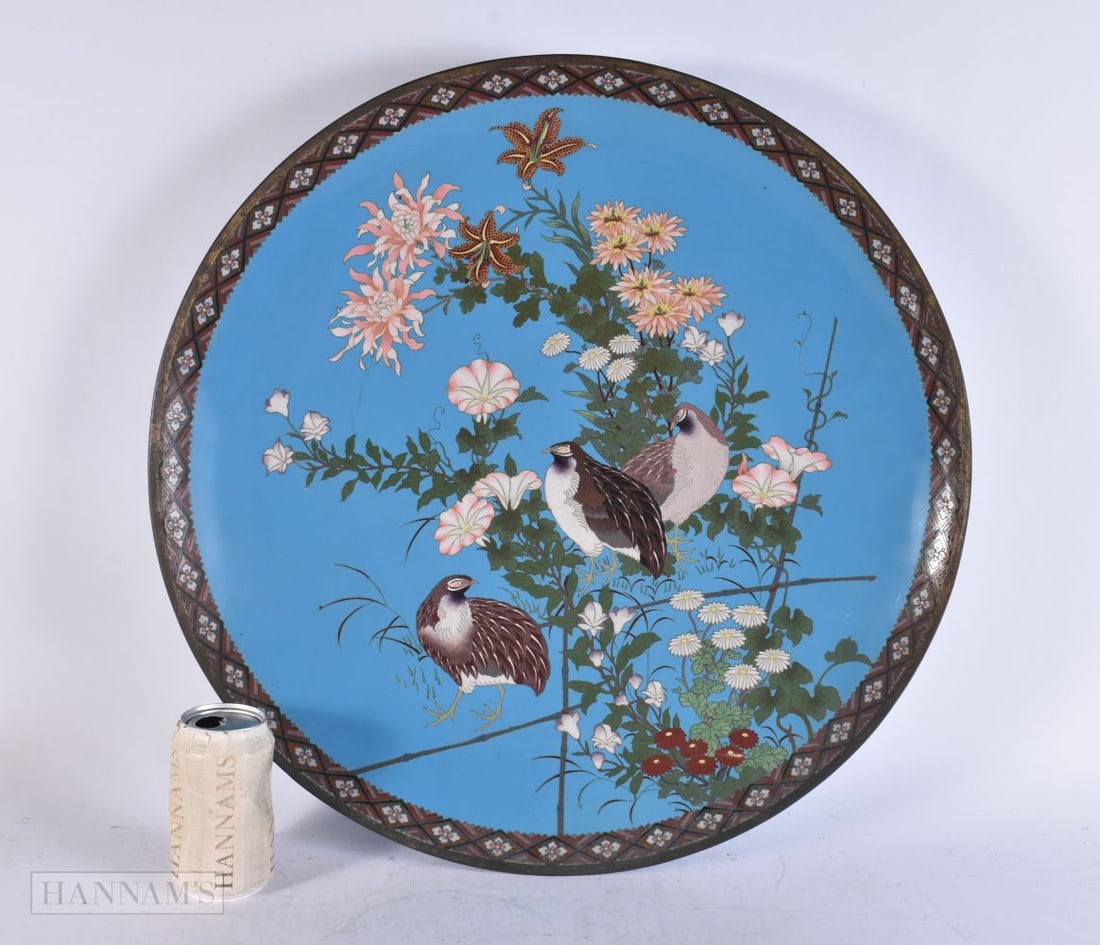 A 19TH CENTURY JAPANESE MEIJI PERIOD CLOISONNE ENAMEL DISH decorated with birds in a landscape. 55 c: A 19TH CENTURY JAPANESE MEIJI PERIOD CLOISONNE ENAMEL DISH decorated with birds in a landscape. 55 cm wide.