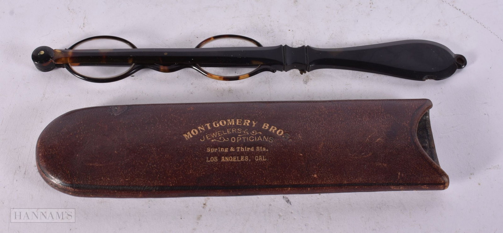 A LARGE PAIR OF TORTOISESHELL LORGNETTES. 28 cm long. (1 of 2)