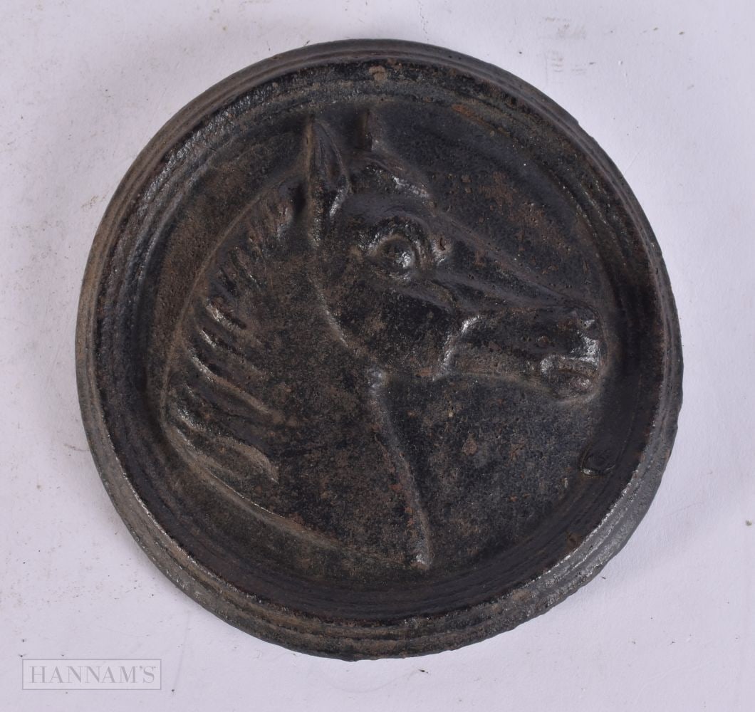 A CAST IRON HORSE ROUNDEL. 14.5 cm wide.: A CAST IRON HORSE ROUNDEL. 14.5 cm wide.