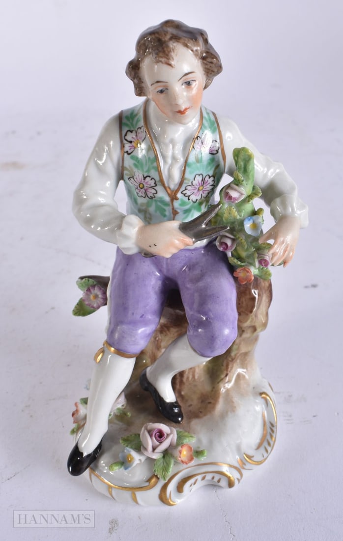 A DRESDEN PORCELAIN FIGURE. 12 cm high.: A DRESDEN PORCELAIN FIGURE. 12 cm high.