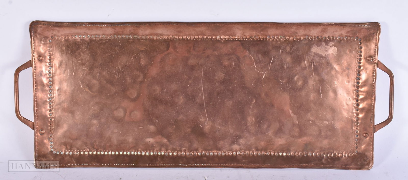 A JOHN PEARSON NEWLYN COPPER TWIN HANDLED TRAY. 58 cm x 22 cm. (1 of 3)