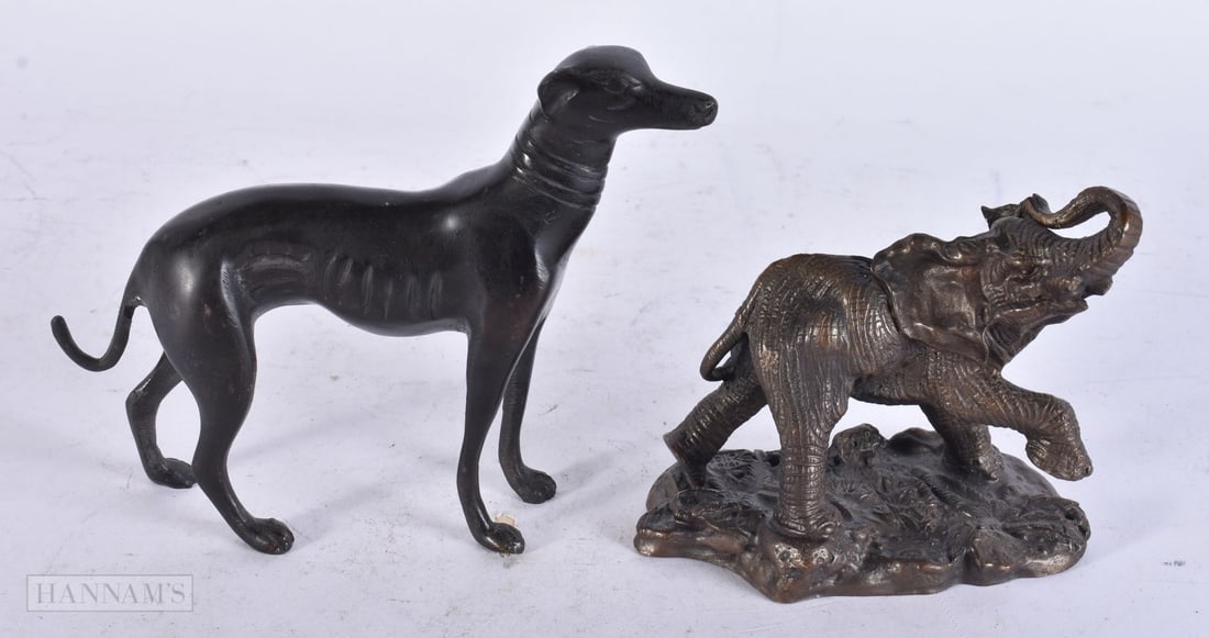A BRONZE GREYHOUND and a Franklin Mint bronze elephant. Largest 12 cm x 12 cm. (2): A BRONZE GREYHOUND and a Franklin Mint bronze elephant. Largest 12 cm x 12 cm. (2)
