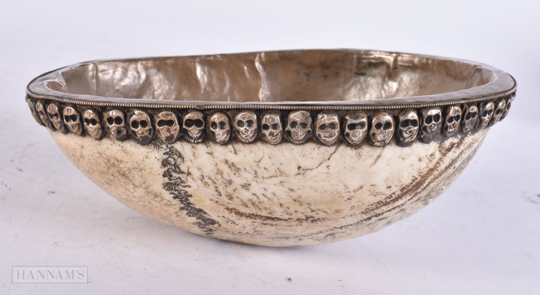 AN 18TH/19TH CENTURY TIBETAN SILVER MOUNTED KAPALA SKULL OFFERING CUP. 18 cm x 12 cm. (1 of 3)