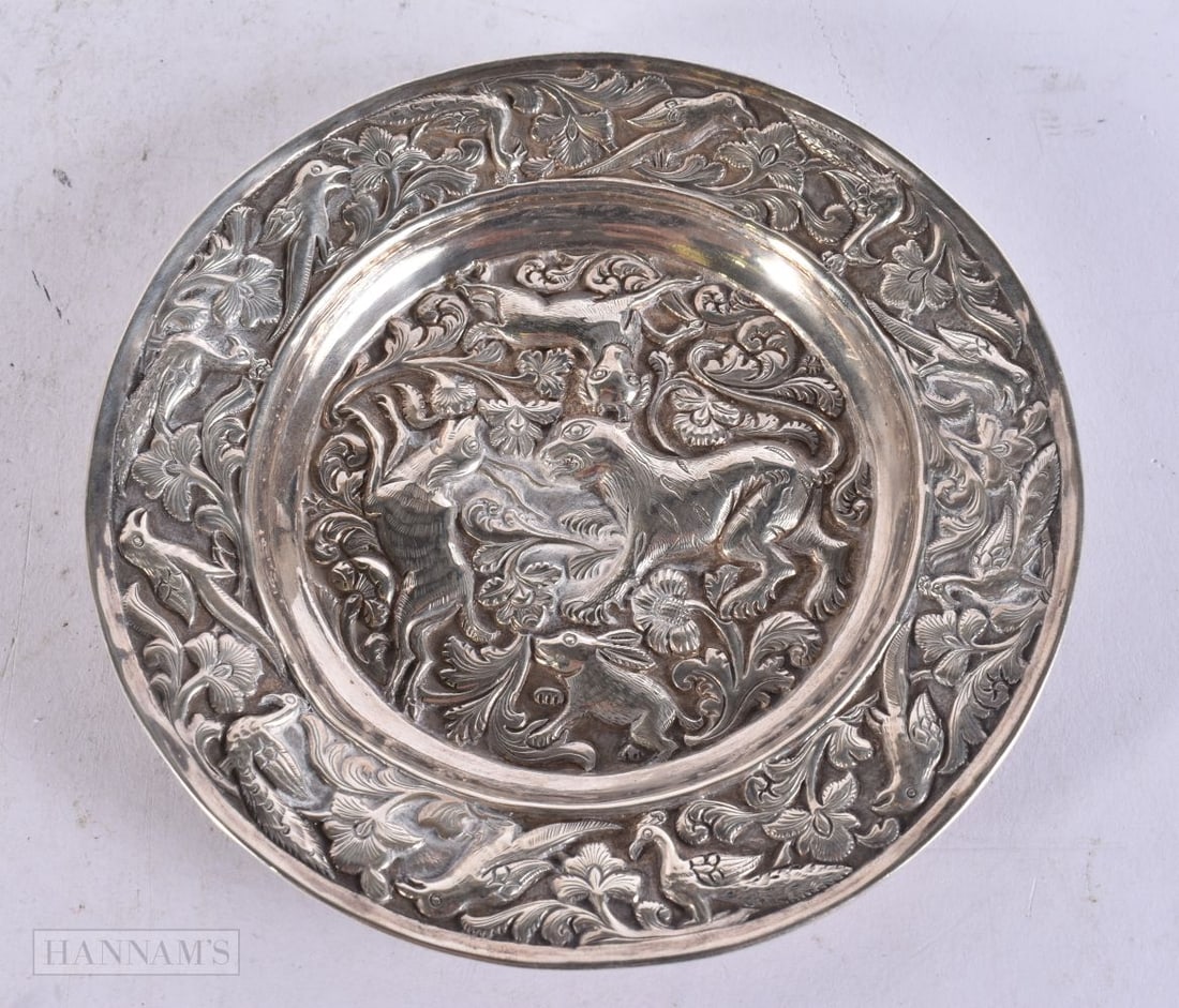 AN EARLY INDIAN SILVER REPOUSSE DISH decorated with animals and foliage. 112 grams. 14 cm wide.: AN EARLY INDIAN SILVER REPOUSSE DISH decorated with animals and foliage. 112 grams. 14 cm wide.
