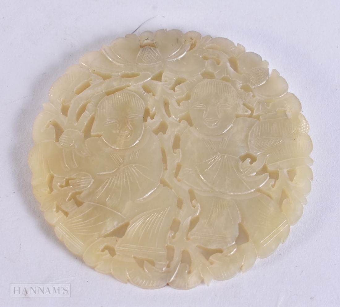 A 19TH CENTURY CHINESE RETICULATED JADE HEHE ERXIAN TWINS PLAQUE Qing. 8 cm wide. (1 of 2)