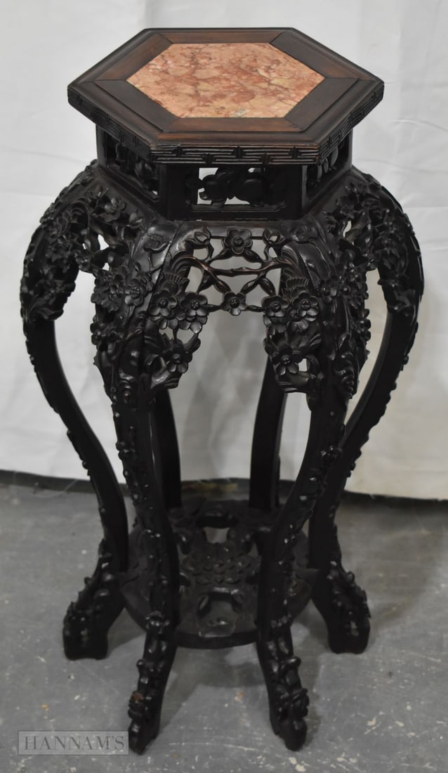 A 19TH CENTURY CHINESE CARVED HARDWOOD HEXAGONAL STAND Qing. 80 cm x 40 cm.: A 19TH CENTURY CHINESE CARVED HARDWOOD HEXAGONAL STAND Qing. 80 cm x 40 cm.