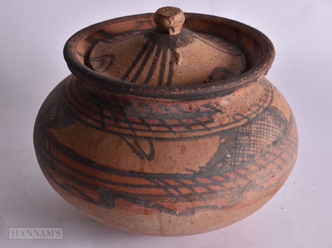 AN INDUS VALLEY POTTERY VESSEL AND COVER. 21 cm x 18 cm. (1 of 3)