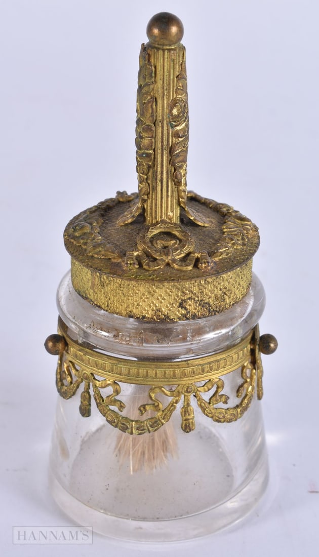 AN UNUSUAL EARLY 20TH CENTURY FRENCH PALAIS ROYALE GILT METAL BRUSH contained within a glass jar. 11 (1 of 3)