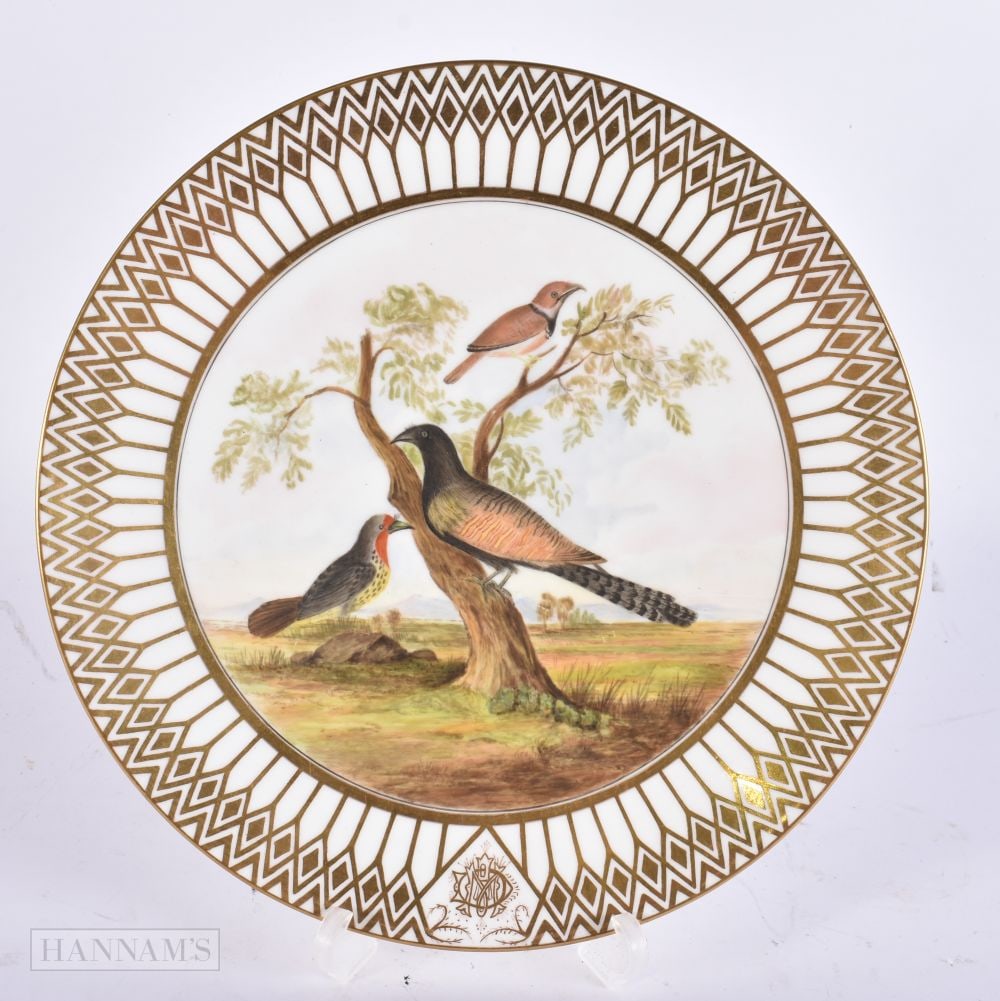 A 19TH CENTURY FRENCH PARIS PORCELAIN PLATE painted with birds in a landscape. 22.5 cm wide.: A 19TH CENTURY FRENCH PARIS PORCELAIN PLATE painted with birds in a landscape. 22.5 cm wide.