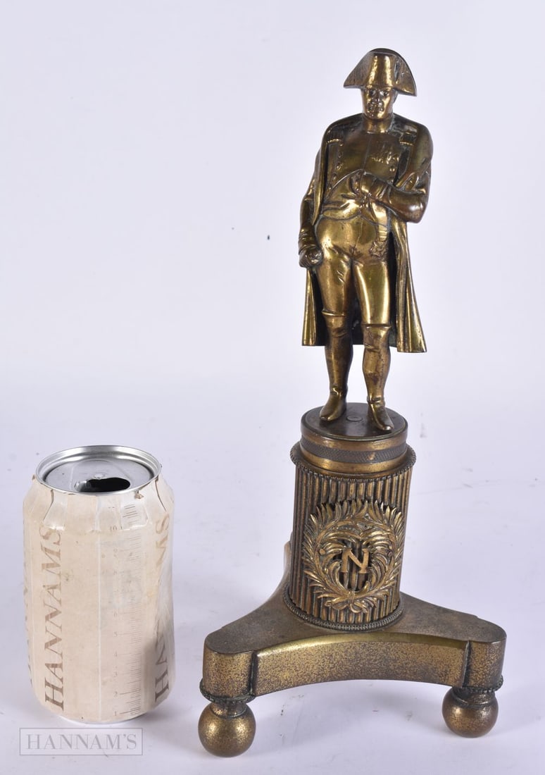 A 19TH CENTURY FRENCH GRAND TOUR BRONZE FIGURE OF NAPOLEON modelled upon a triangular base. 30 cm hi: A 19TH CENTURY FRENCH GRAND TOUR BRONZE FIGURE OF NAPOLEON modelled upon a triangular base. 30 cm high.