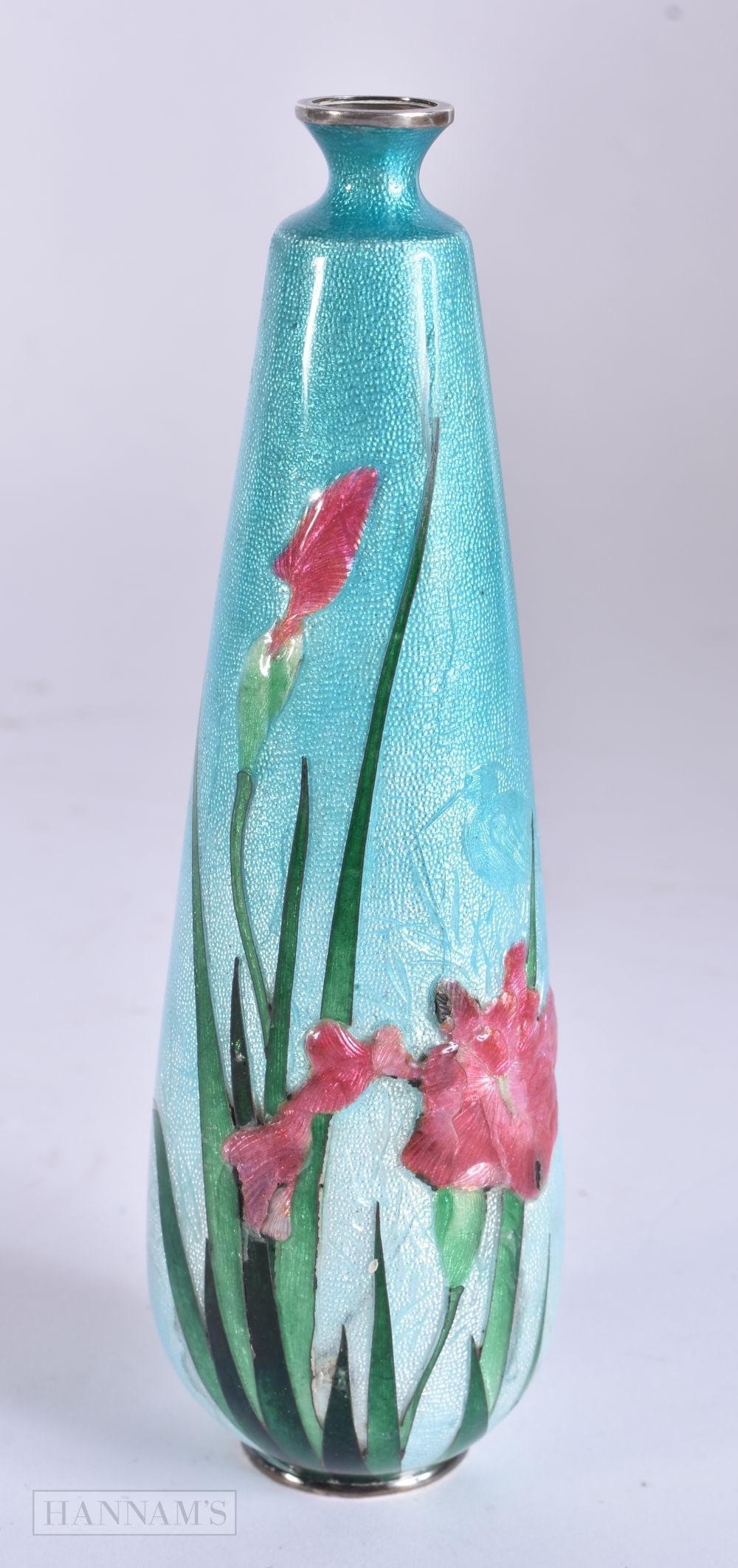 AN EARLY 20TH CENTURY JAPANESE MEIJI PERIOD SILVER AND ENAMEL VASE decorated in relief with foliage: AN EARLY 20TH CENTURY JAPANESE MEIJI PERIOD SILVER AND ENAMEL VASE decorated in relief with foliage and reeds, encasing a subtle brace of herons under the rushes. 92 grams. 15 cm high.