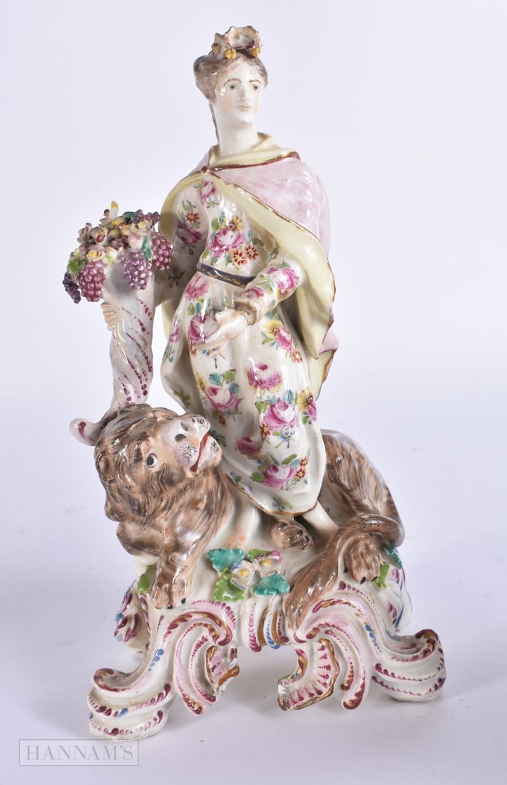 AN 18TH CENTURY BOW ALLEGORICAL PORCELAIN FIGURE OF A FEMALE modelled standing upon a lion. 23 cm hi: AN 18TH CENTURY BOW ALLEGORICAL PORCELAIN FIGURE OF A FEMALE modelled standing upon a lion. 23 cm high.