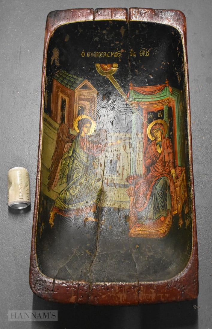 AN UNUSUAL LARGE 19TH CENTURY GREEK ORTHODOX ICON WOOD TROUGH/BASIN painted with Mary 'Mother of God: AN UNUSUAL LARGE 19TH CENTURY GREEK ORTHODOX ICON WOOD TROUGH/BASIN painted with Mary 'Mother of God', Gabriel, the inscription reading 'The Annunciation of the Theotokos'. 90 cm x 42 cm x 15 cm.