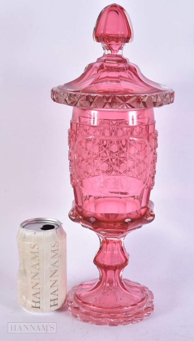 A LARGE BOHEMIAN CUT RUBY GLASS VASE AND COVER. 39 cm high.: A LARGE BOHEMIAN CUT RUBY GLASS VASE AND COVER. 39 cm high.