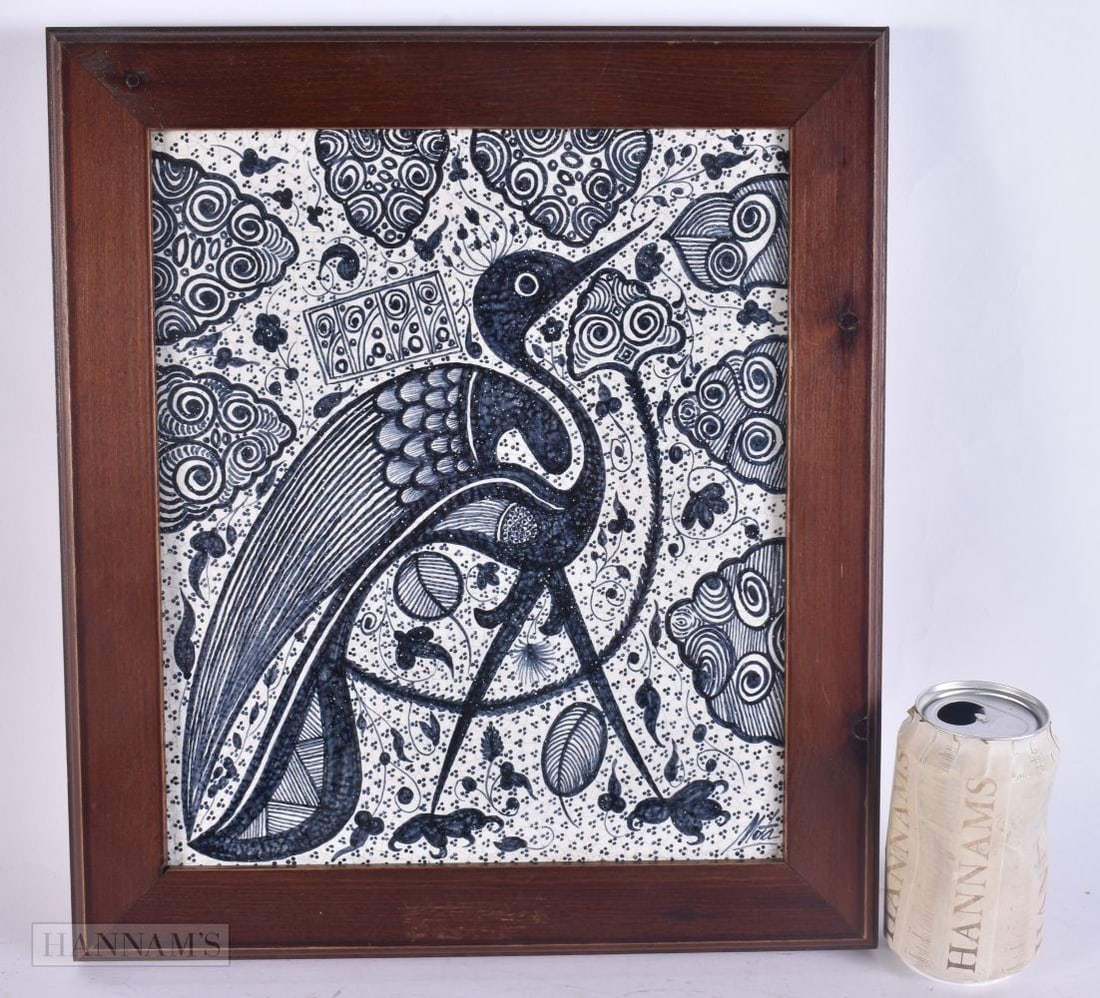 A LARGE CONTINENTAL BLUE AND WHITE POTTERY TILE painted with a stylised bird. 38 cm x 32 cm. (1 of 5)