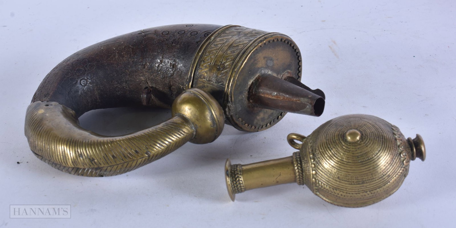 AN EARLY 19TH CENTURY ISLAMIC MIDDLE EASTERN HORN POWDER FLASK together with a Middle Eastern bronze (1 of 8)