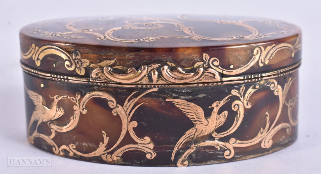 A LATE 18TH/19TH CENTURY CONTINENTAL YELLOW METAL INLAID SNUFF BOX decorated with birds and scrolls. (1 of 6)