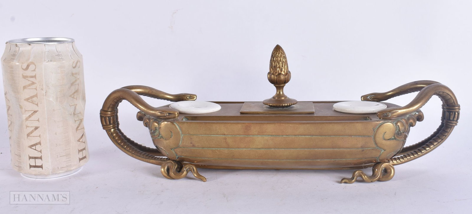 A LARGE 19TH CENTURY GRAND TOUR BRONZE SERPENT INKWELL with flaming finial to central compartment. 2: A LARGE 19TH CENTURY GRAND TOUR BRONZE SERPENT INKWELL with flaming finial to central compartment. 29 cm wide.