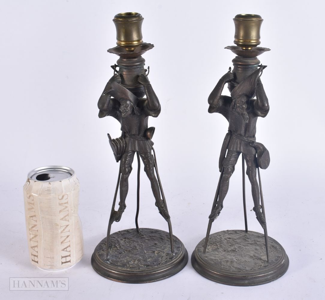 AN UNUSUAL PAIR OF LATE VICTORIAN/EDWARDIAN SPELTER STILT MEN CANDLESTICKS. 29 cm high. (1 of 6)