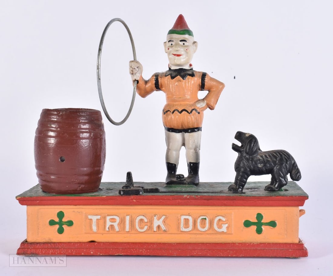 CAST IRON TRICK DOG MONEY BANK. 21 cm x 18 cm. (1 of 5)