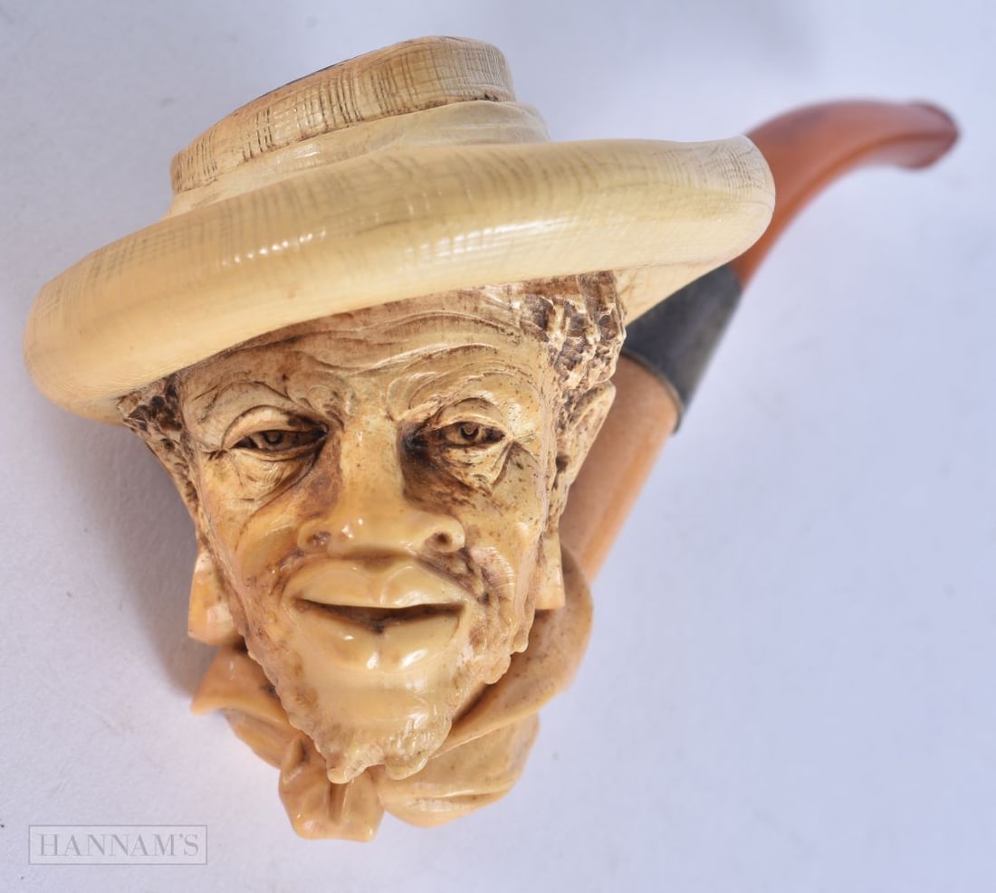A MEERSCHAUM PIPE formed as a Nubian male. 14.5 cm wide. (1 of 5)