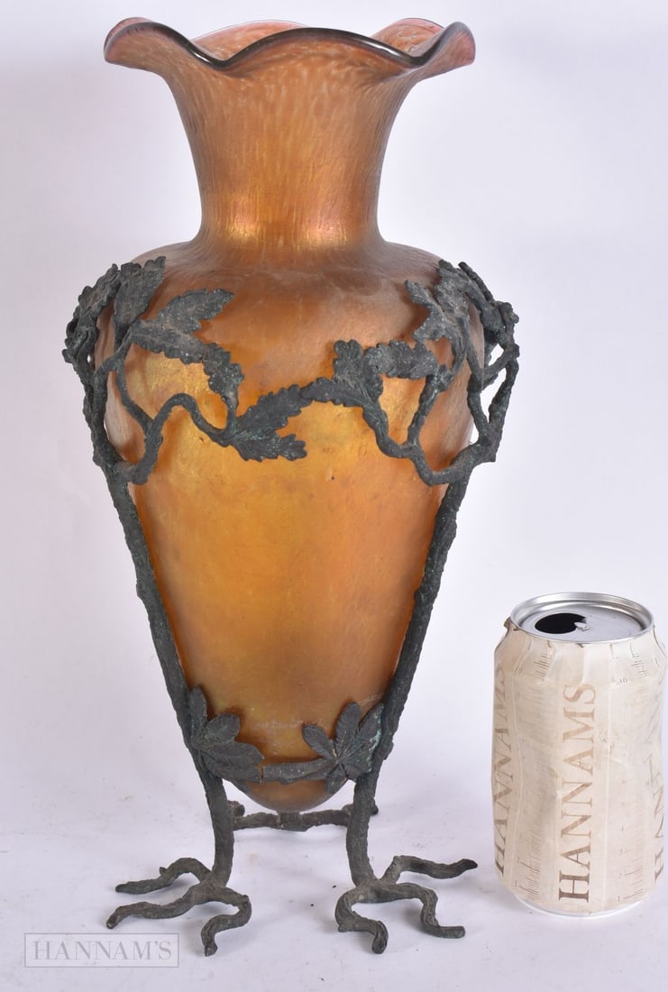 AN ART NOUVEAU AUSTRIAN IRIDESCENT GLASS VASE within a bronze organic scrolling base. 33 cm high. (1 of 7)