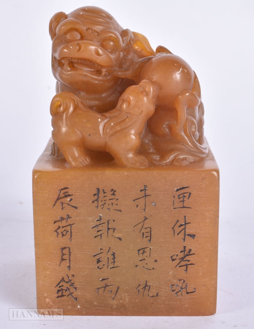 A CHINESE CARVED ORANGE SOAPSTONE BUDDHISTIC LION CALLIGRAPHY SEAL. 9.5 cm x 5.5 cm. (1 of 6)