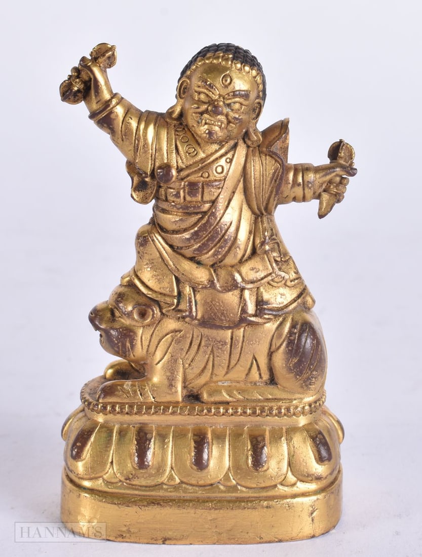 AN ANTIQUE TIBETAN BRONZE FIGURE OF A BUDDHIST DEITY. 8.5 cm x 4.5 cm. (1 of 6)