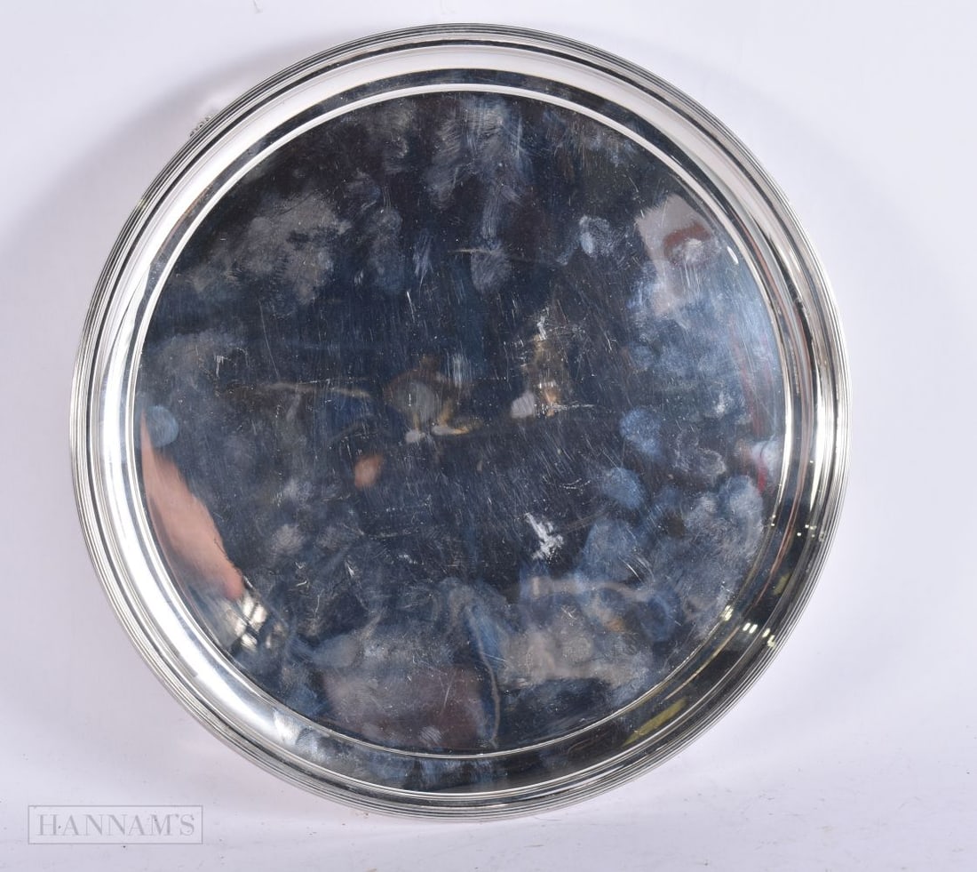 AN ANTIQUE SILVER SALVER. 760 grams. 28 cm diameter. (1 of 3)