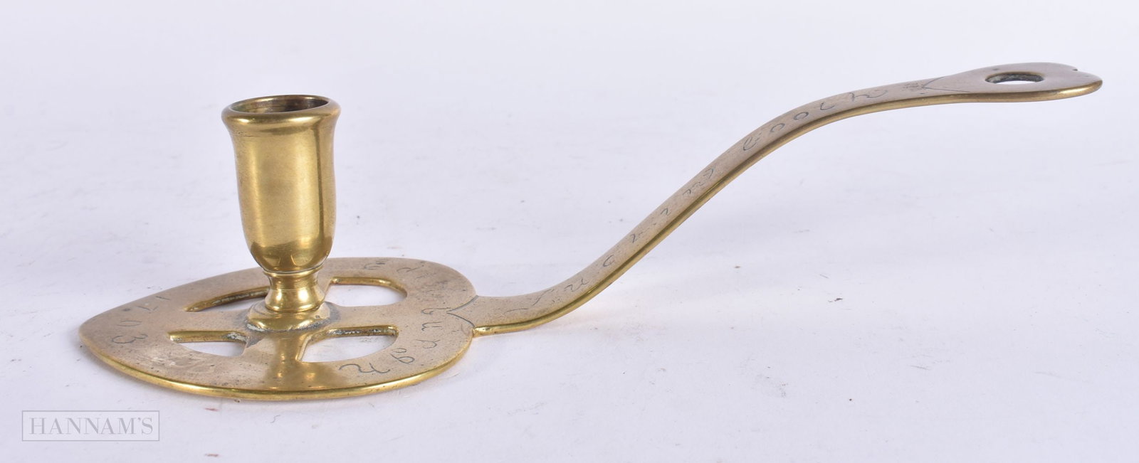 AN UNUSUAL ANTIQUE SCOTTISH BRASS CHAMBERSTICK. 22 cm wide.: AN UNUSUAL ANTIQUE SCOTTISH BRASS CHAMBERSTICK. 22 cm wide.