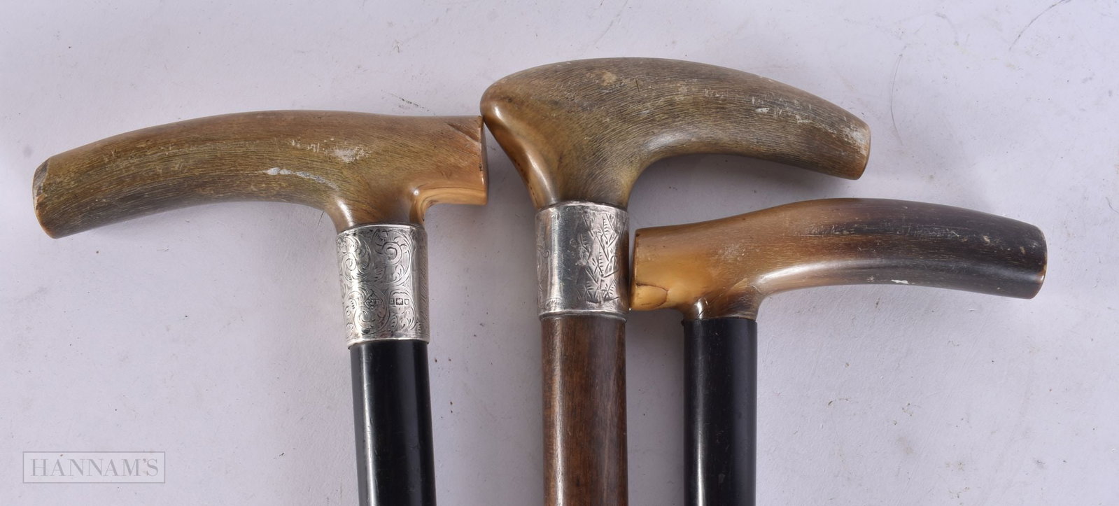 THREE 19TH CENTURY CARVED RHINOCEROS HORN WALKING CANES. 90 cm long. (3) (1 of 5)
