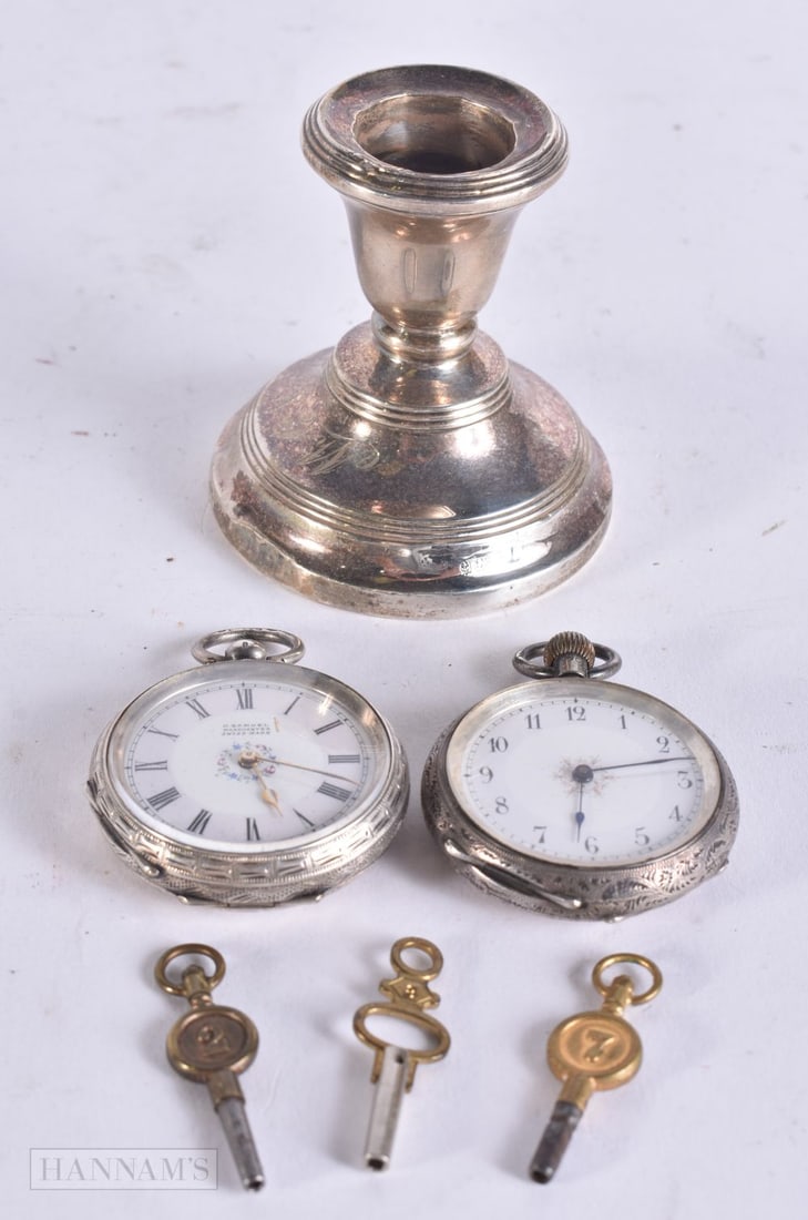 TWO ANTIQUE SILVER POCKET WATCHES and a silver candlestick. 198 grams overall. (3) (1 of 8)