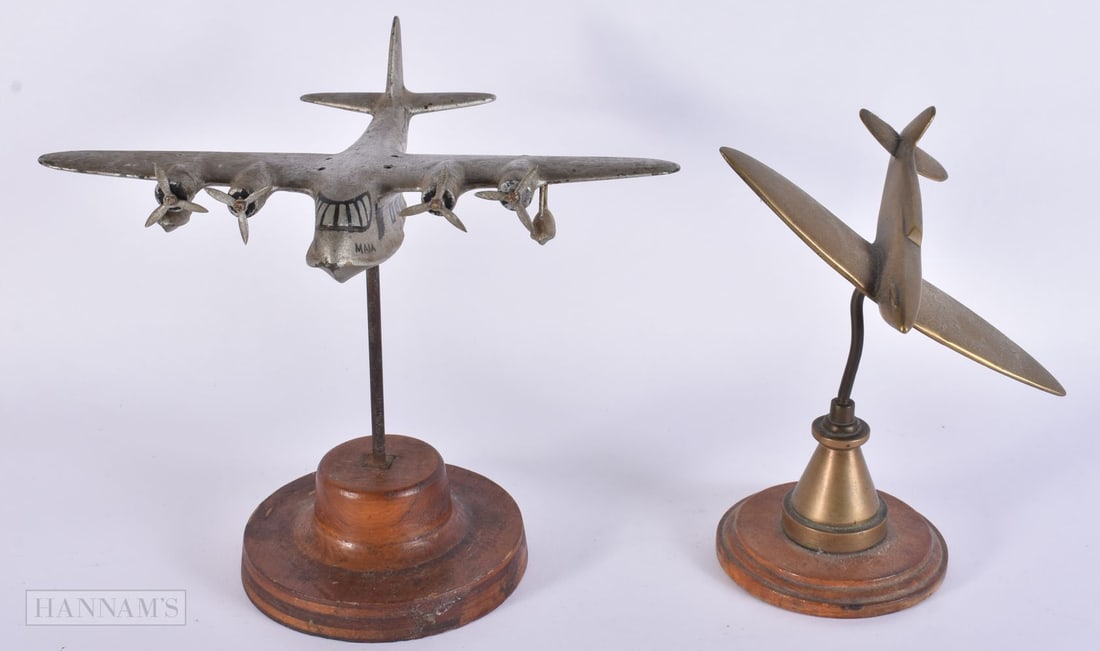 A WWII TRENCH ART SPITFIRE together with another painted plane. Largest 18 cm x 18 cm. (2) (1 of 4)