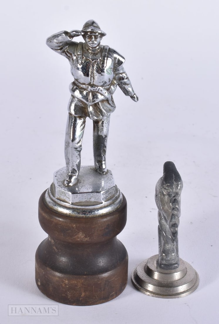A SAILOR CAR MASCOT together with a pixie mascot. Largest 15.5 cm high. (2) (1 of 5)