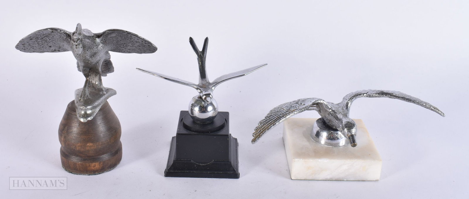 A DESMO WINGED BIRD CAR MASCOT together with two other bird mascots. Largest 15.5 cm wide. (3) (1 of 5)