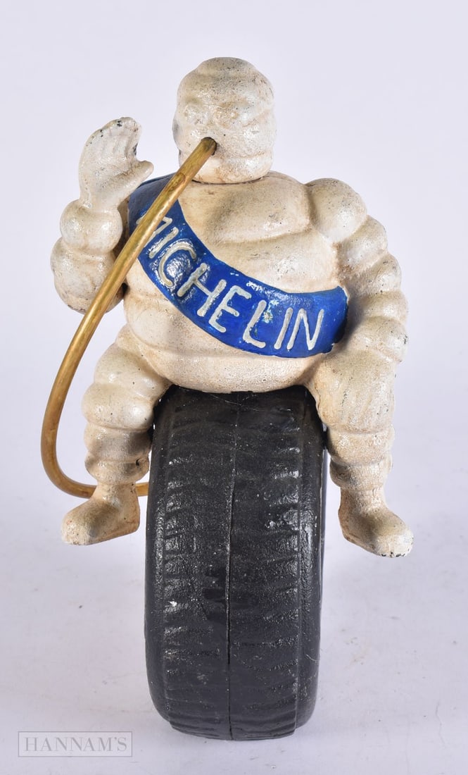A MICHELIN MAN BIBENDUM. 24.5 cm high. (1 of 4)