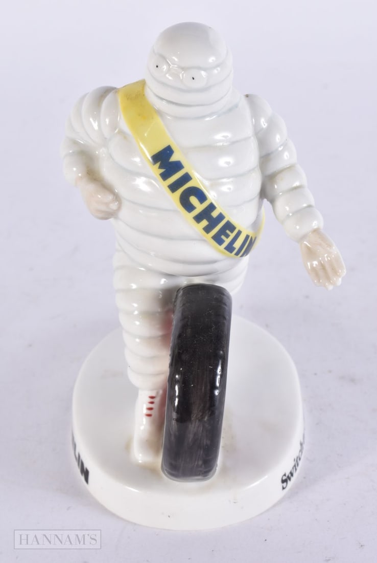 A ROYAL DOULTON MICHELIN MAN FIGURE. 15 cm x 9 cm. (1 of 5)