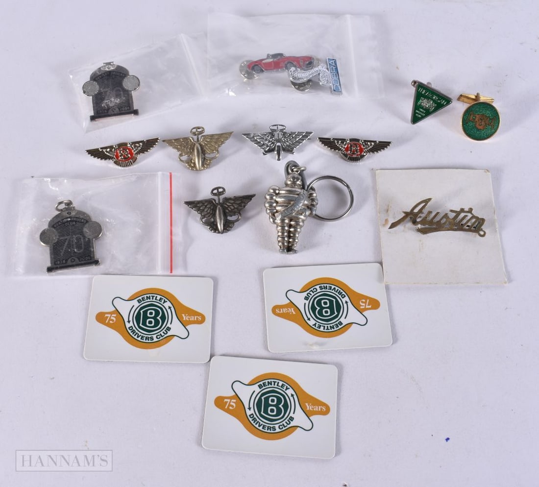 A MICHELIN MAN KEYRING together with automotive badges etc. (qty): A MICHELIN MAN KEYRING together with automotive badges etc. (qty)