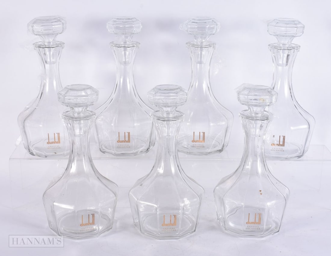 SEVEN DUNHILL CRYSTAL GLASS DECANTERS AND STOPPERS. 27 cm high. (7) (1 of 5)