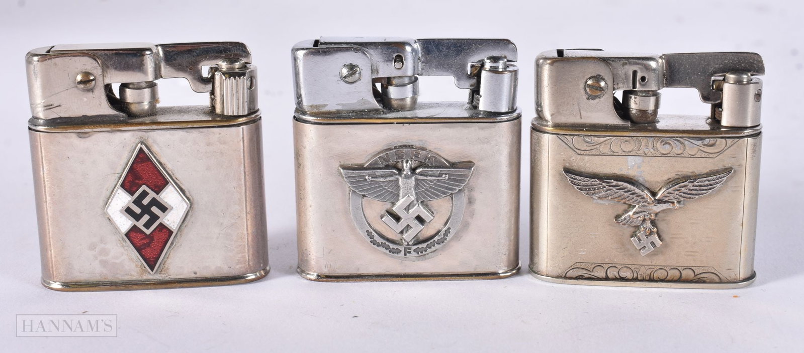 THREE GERMAN WWII LIGHTERS including one enamelled lighter. (3) (1 of 3)