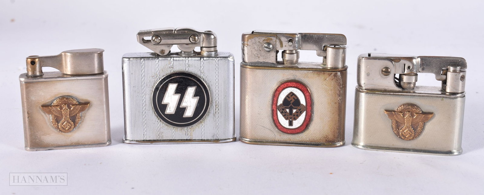 FOUR GERMAN WWII LIGHTERS including two enamelled examples. (4) (1 of 3)