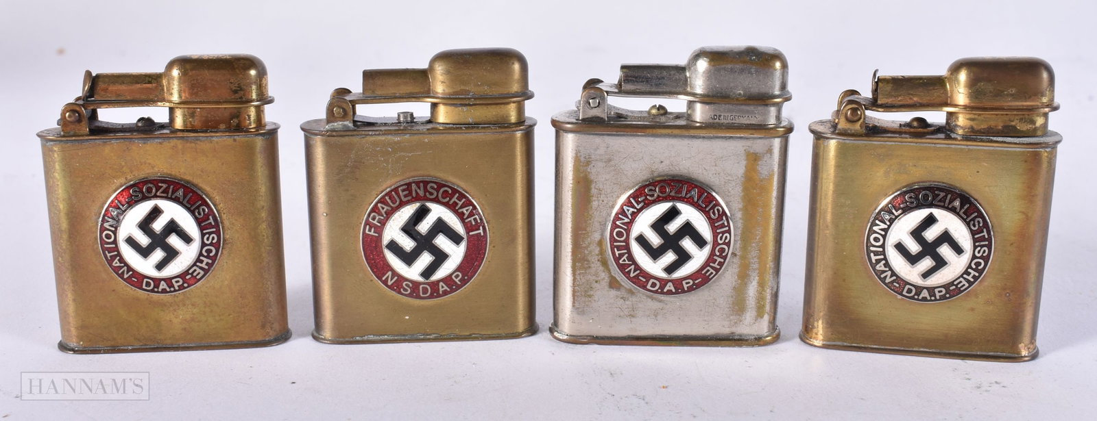 FOUR GERMAN WWII ENAMELLED LIGHTERS. (4) (1 of 3)