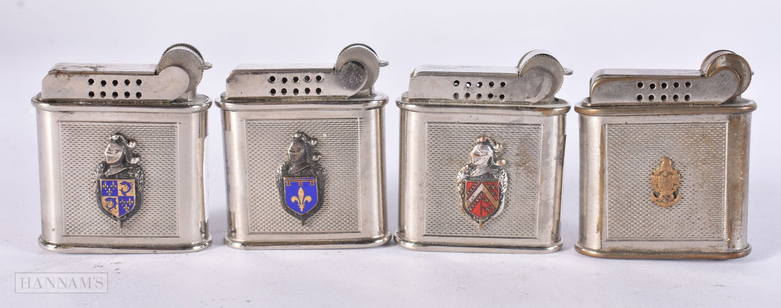 FOUR FRENCH PARIS ENAMELLED ARMORIAL DRAGO LIGHTERS. (4) (1 of 3)