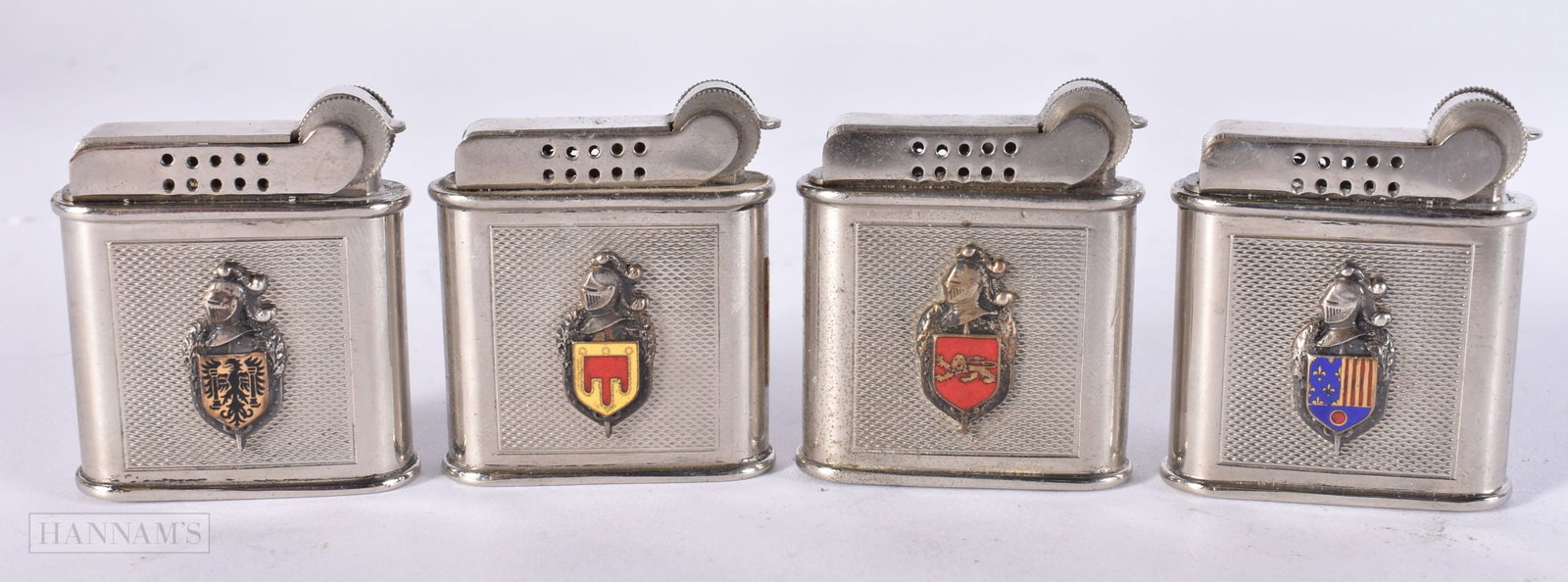 FOUR FRENCH PARIS ENAMELLED ARMORIAL DRAGO LIGHTERS. (4) (1 of 3)
