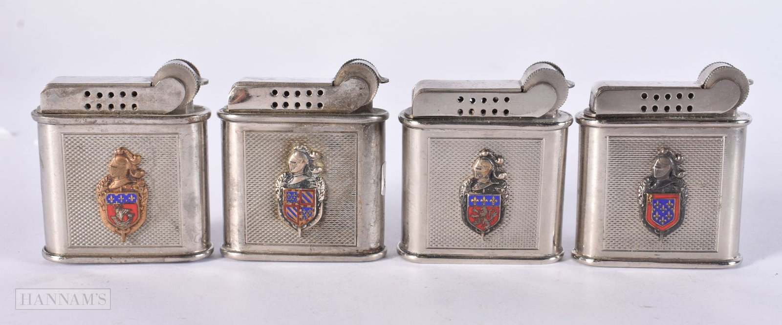 FOUR FRENCH PARIS ENAMELLED ARMORIAL DRAGO LIGHTERS. (4) (1 of 3)