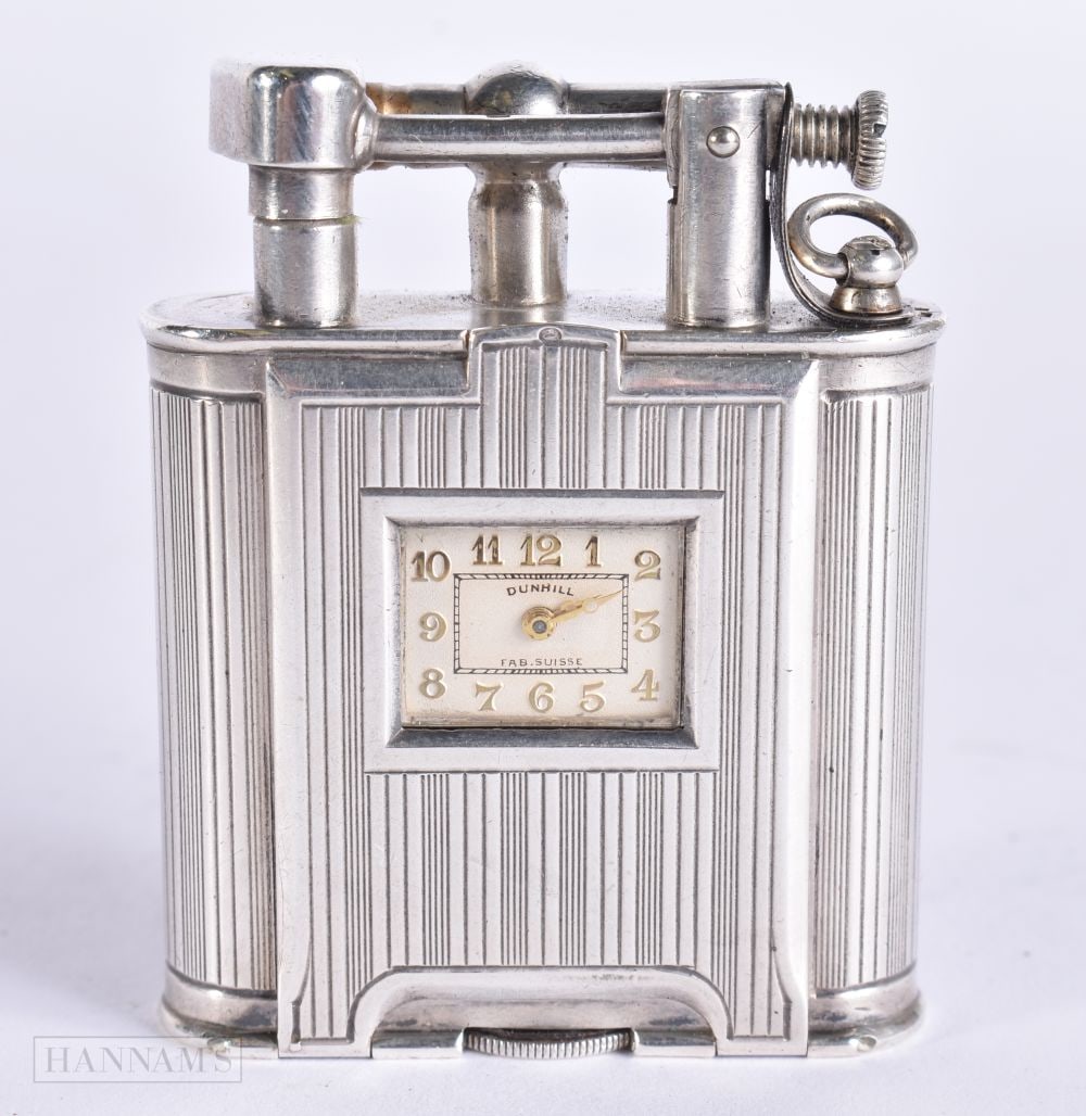 A RARE ART DECO DUNHILL SILVER CLOCK LIGHTER. 5.5 cm high.: A RARE ART DECO DUNHILL SILVER CLOCK LIGHTER. 5.5 cm high.